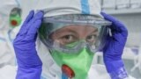 A medical specialist puts on personal protective equipment in Moscow's  RZD-Medicine Central Clinical Hospital, which treats coronavirus patients.  