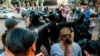 Riot police spray tear gas in the faces of protesters in Brest at a peaceful protest  against the government on September 20, 2020.